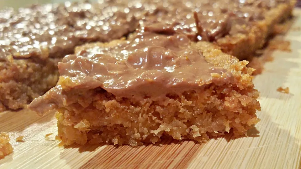 Snapdishの料理写真:coconut  and wheatbix slice with cadburry crunchie ganache|Kookai Santos-Verzosaさん