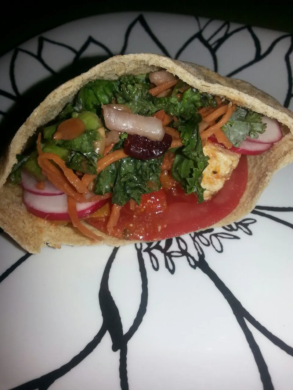 pita with tomato,  sliced radish, fresh kale salad,  And chipotle marinated tofu.|Polly Gelfusoさん