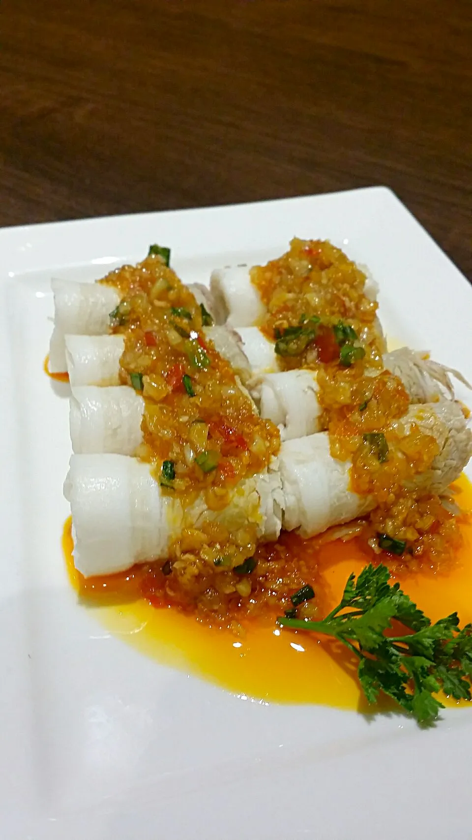 Rolled up sliced bacon with chilli garlic topping|jorccyさん