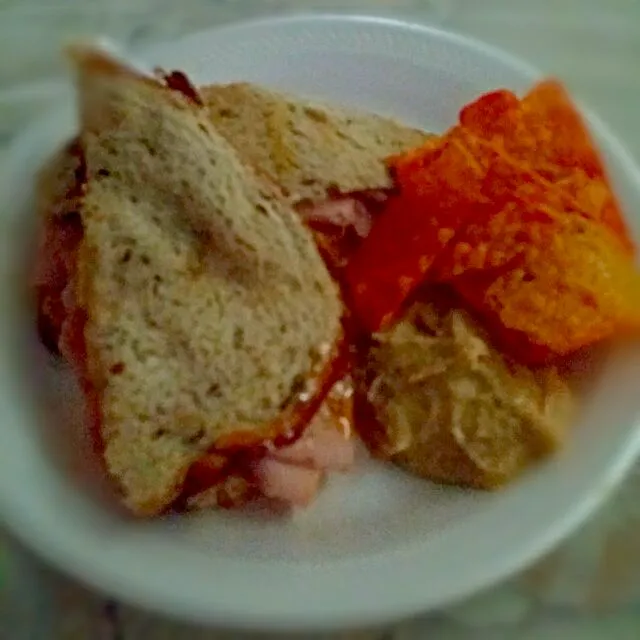 Snapdishの料理写真:Turkey and cheese on rye bread with hummus and doritos and crystal lite on the side|christl babcockさん