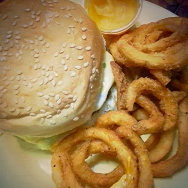 Beef burger with side of Potato curly fries and chedder cheese dipping|Nura Hazさん