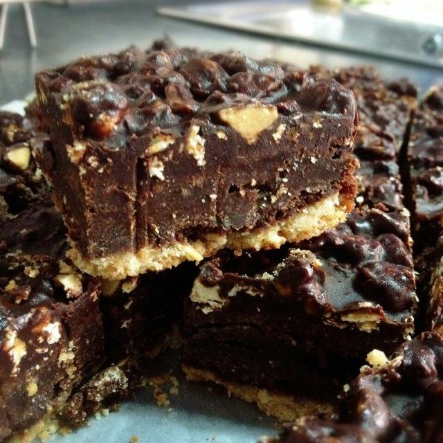 fudgy brownies with graham cracker base n top with garette popcorn chocolate