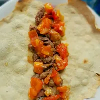 whole grain flat bread + pork + tomatoes and onion + lime and sugar cane dressing|Irene Chiocchiaさん