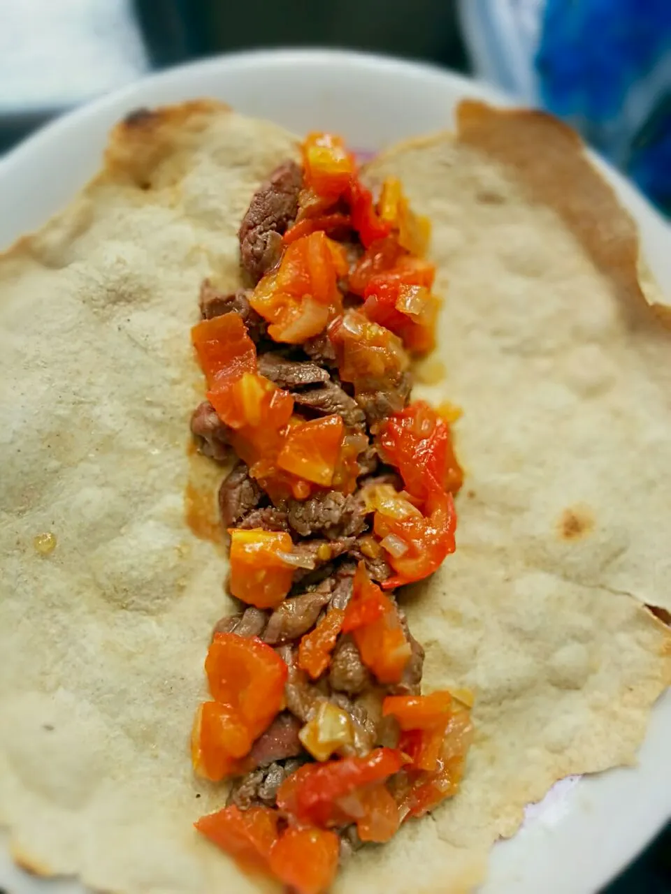 whole grain flat bread + pork + tomatoes and onion + lime and sugar cane dressing|Irene Chiocchiaさん