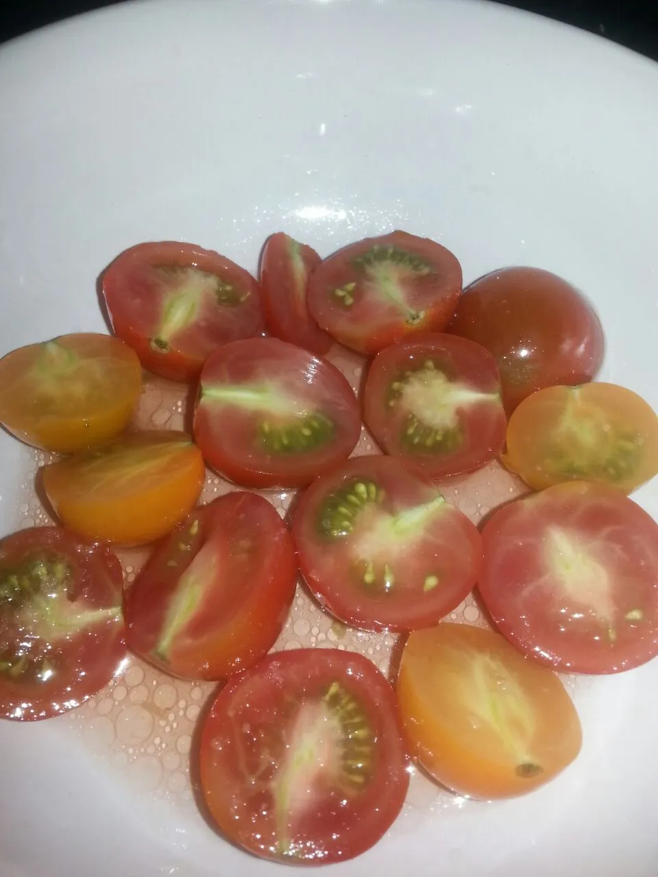 Snapdishの料理写真:fresh tomatoes from the local farm.  simple with agreed red wine vinegar,  Himalayan pink sea salt, and grapeseed oil.|Polly Gelfusoさん