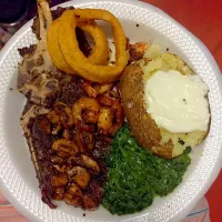 Snapdishの料理写真:Pan seared steak with sautéed mushrooms, grilled shrimp,  creamed spinach, onion rings and a baked potato|MissKokoaさん