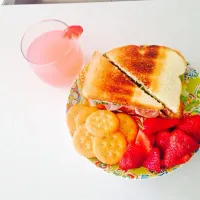 Turkey sandwich w/ crackers and strawberries. And with the side of homemade raspberry lemonade juice|kenberlin fermanさん