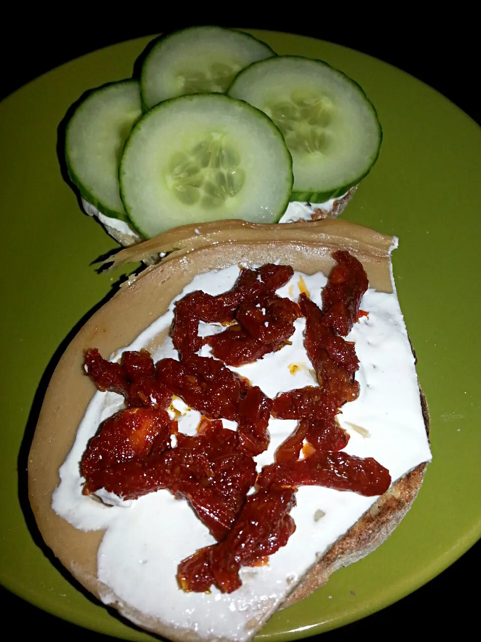 my take on a blt.  English muffin,  sundried tomatoes,  cream chz,  capers,  cucumber,  And tofurkey.|Polly Gelfusoさん