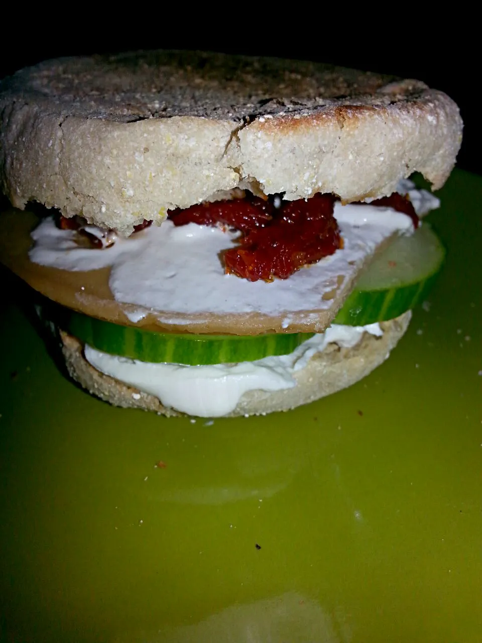 my "blt". English muffin,  sundried tomato,  cucumber,  capers,  cream chz,  tofurkey.|Polly Gelfusoさん