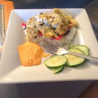 Snapdishの料理写真:Tilapia with rice and nachos trips and cucumber slices|christen hashiguchiさん