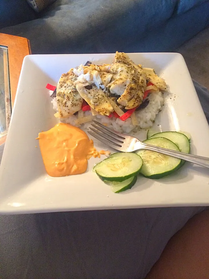 Snapdishの料理写真:Tilapia with rice and nachos trips and cucumber slices|christen hashiguchiさん