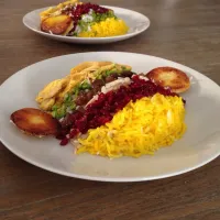 Morasa polo (traditional persian dish) cooked rice with saffron, chicken, Pistachios, almonds, barberries, raisins, orange peels and carrot|sepidehさん