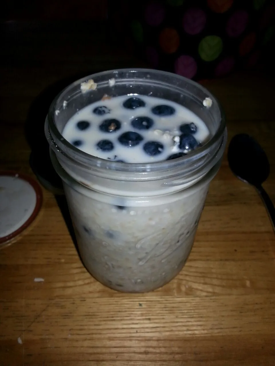 my overnight refrigerator oats.  with pb,  vegan hazelnut choc spread,  fresh blueberries,  And almond milk.|Polly Gelfusoさん