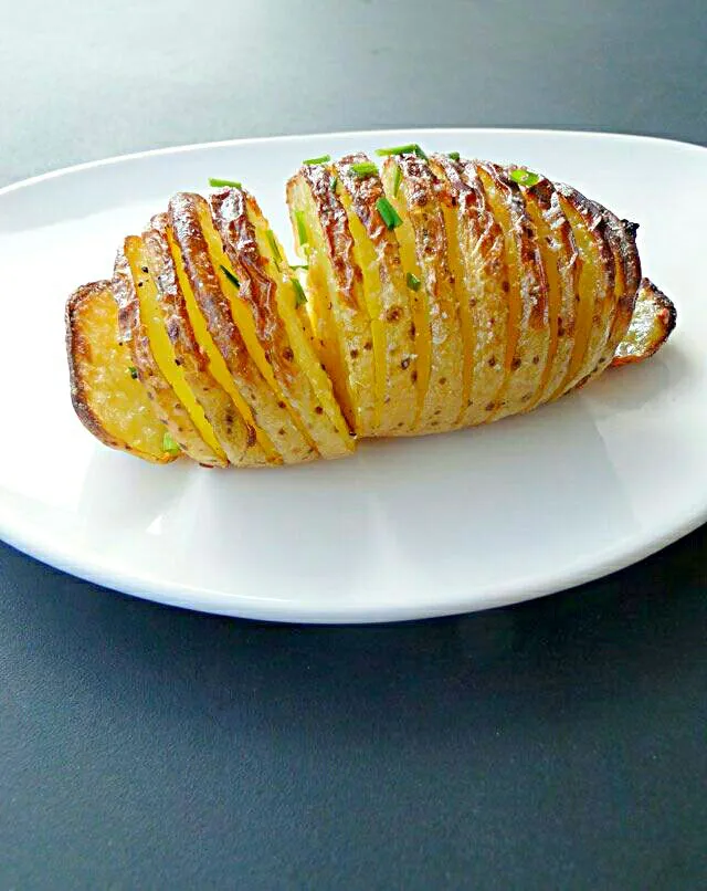 Snapdishの料理写真:currently  cooked Hasselbeck #potatoes #American cuisine|Alisha GodsglamGirl Matthewsさん