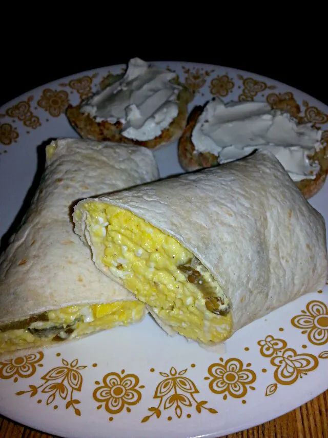 Snapdishの料理写真:my son's breakfast.  4 cheesy scrambled eggs with parm,  American chz, and jalapenos.  with a buttered roasted English muffin with cream chz|Polly Gelfusoさん