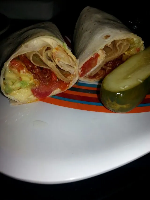 wrap with avocado,  tomato,  sundried tomato,  mayo,  spicy mUstard,  hot peppers, and a huge pickle! !|Polly Gelfusoさん