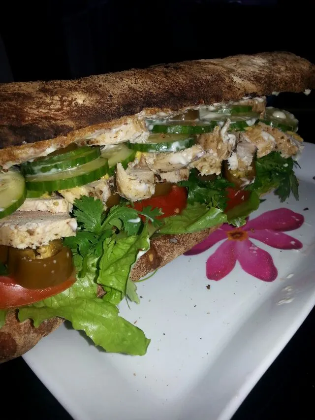 Snapdishの料理写真:crusty chibatta with local tomato,  local cucumber,  blue chz spread,  mayo,  spicy brown mUstard,  romaine,  fresh cilantro,  roasted chix,  And homemade picke|Polly Gelfusoさん