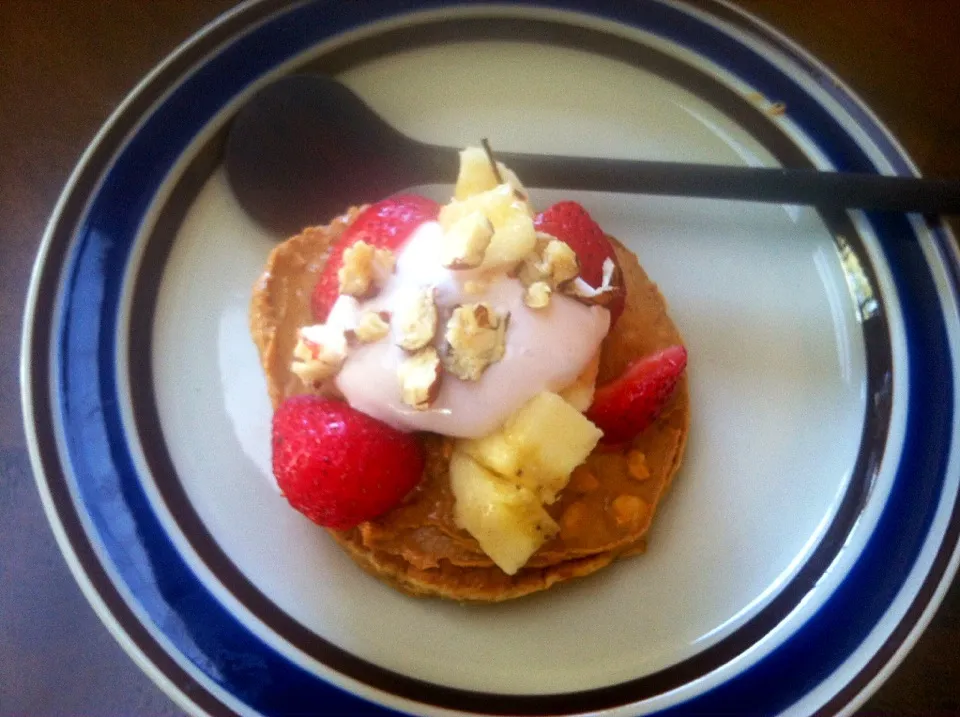 Snapdishの料理写真:Vegan pancakes with peanut butter, strawberries, banana, and a dollop of strawberry Greek yogurt with hazelnuts sprinkled on top|victoria valerioさん