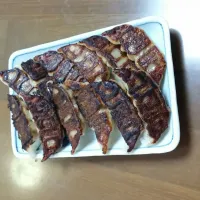 Snapdishの料理写真:焼き餃子。
札幌の名店、みよしの餃子。
チルドタイプを家で焼いた。
ちょっと焼きすぎが好み。|masahiroさん