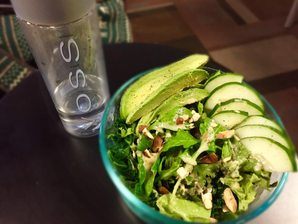 Vegan bowlkalearugulalettuce with avocadocucumberalmonds with citrus