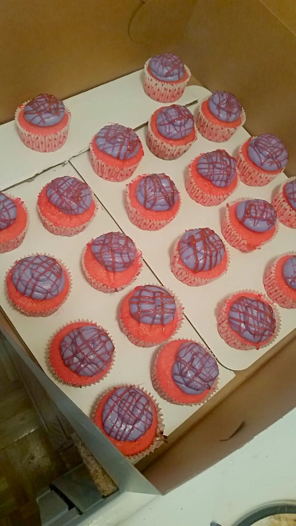 Pink cupcakes, purple frosting, and drizzled with pink "spun sugar"|Jacki Carterさん