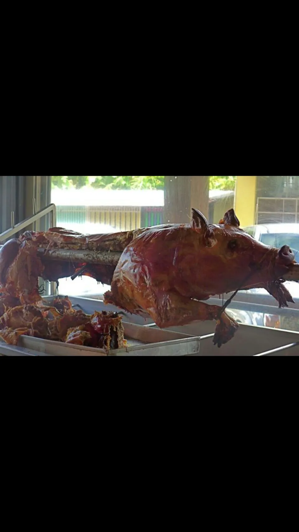 Snapdishの料理写真:Typical  pig roast  stand in Puerto Rico.|Frank Ortizさん