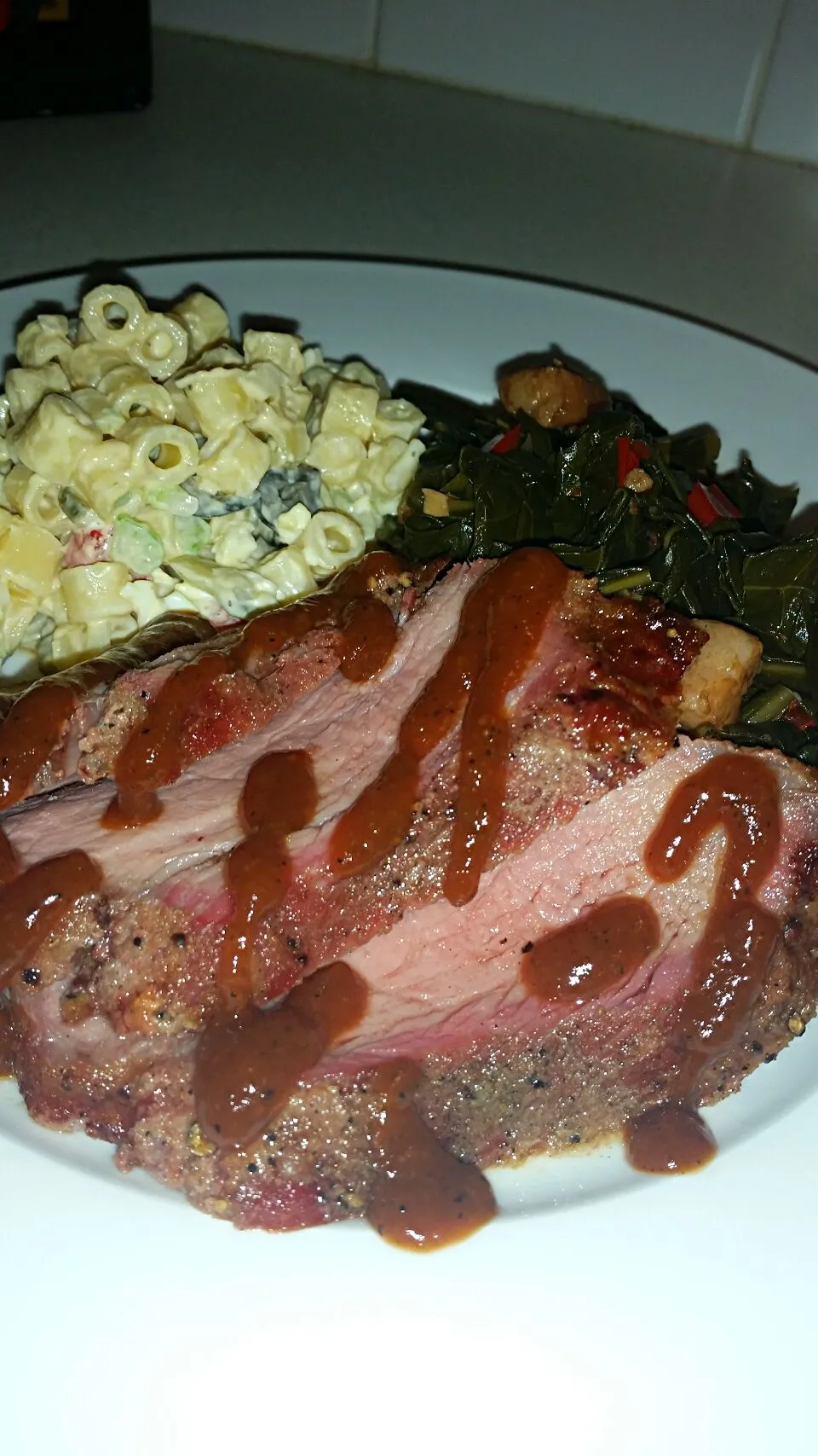 Snapdishの料理写真:Smoked tri-tip, with scratch made leach bourbon BBQ sauce.... greens with smoked jowl, and classic mac salad.... yum.|Jenn Strangeさん