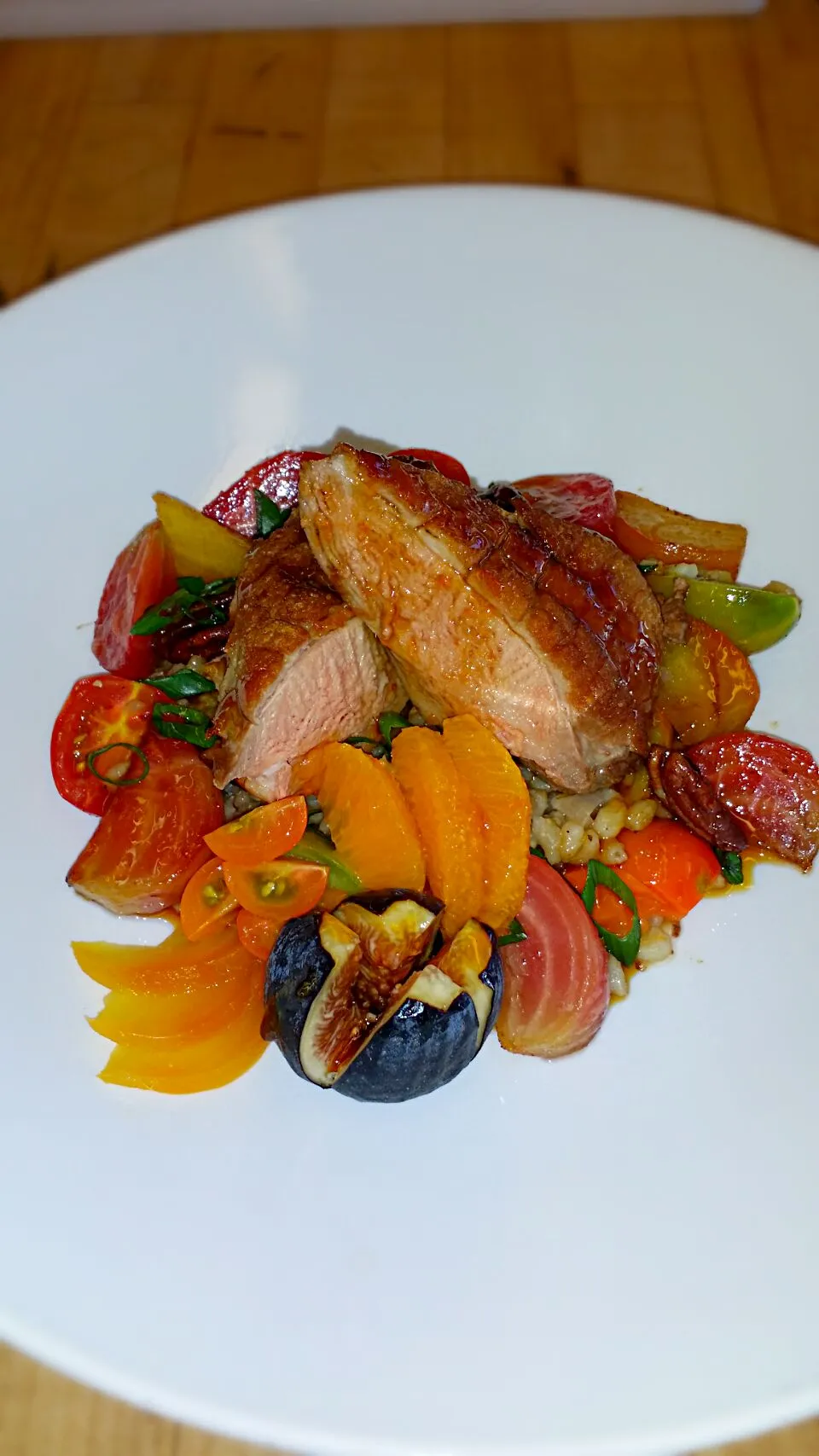 Duck over a barley salad and topped with a citrus glaze.|Tiffany Provinsさん