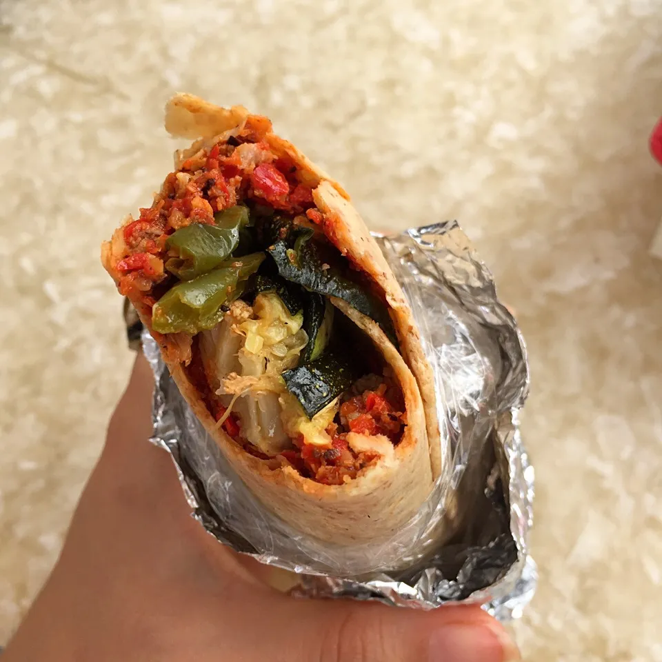 Whole wheat wrap with red pepper spread with grilled zucchini, cauliflower and green peppers.|victoria valerioさん