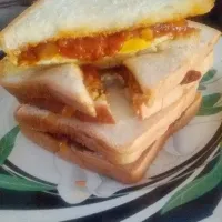 Snapdishの料理写真:egg sandwiches with spaghetty sauce.. its yummy for snack.. #Sandwich #experiment|wulandikaさん