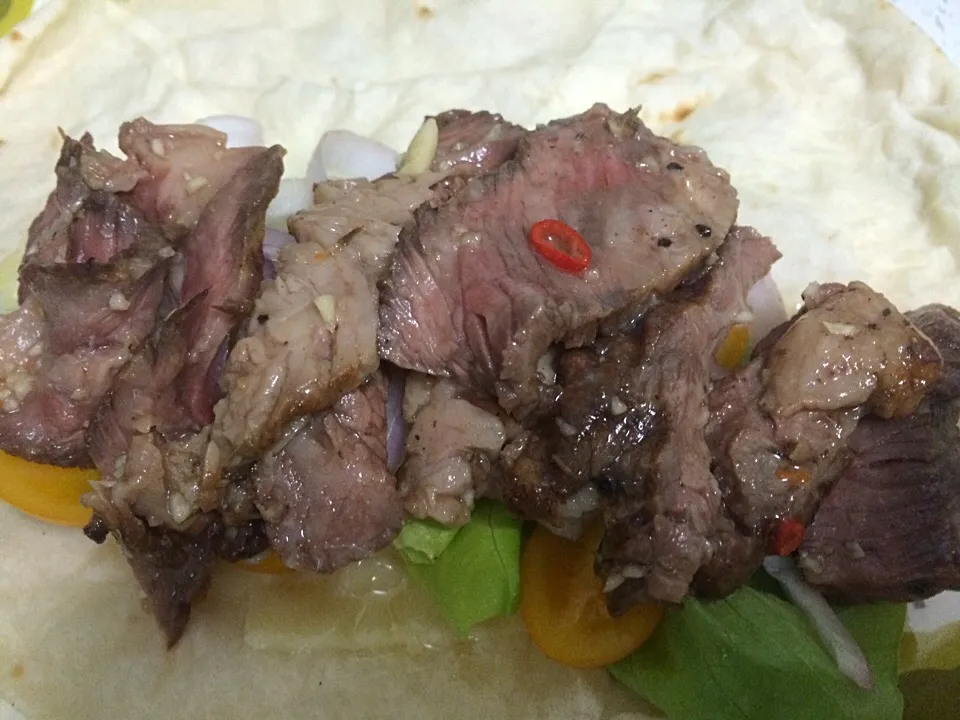 Recycling leftover wagyu steak with a bit of Thai style dressing in a wrap with sweet pickled onions and melted Gruyere|Ong Sor Fernさん