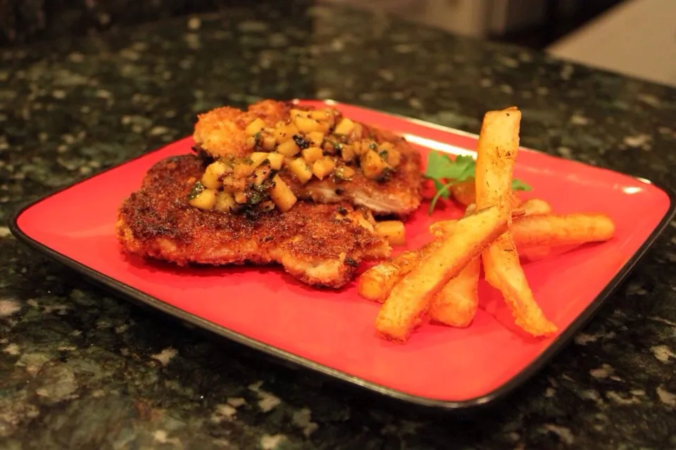 Fried pork cutlets with apple chutney and pomme frites.|Mike Foshéeさん