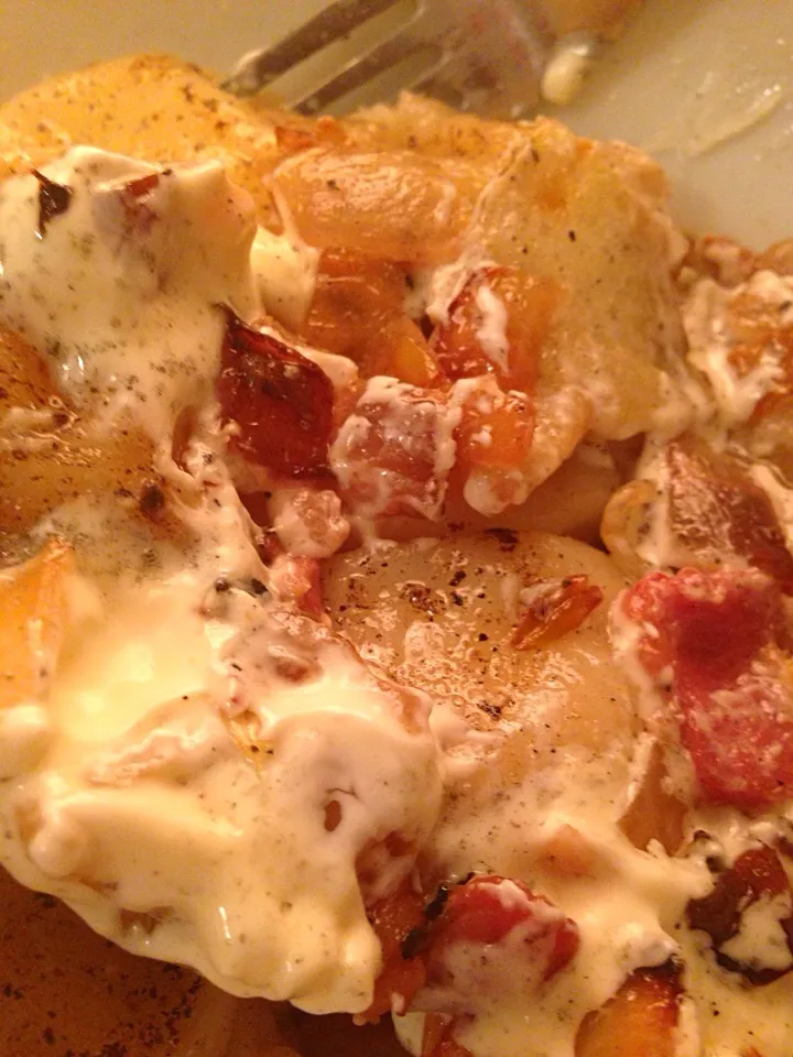 Pierogies with sour cream, bacon and onions...yum!|Miriam Hughesさん