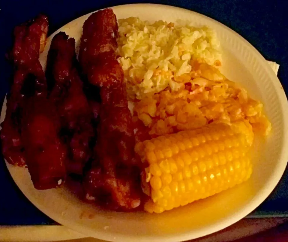 Snapdishの料理写真:Three flavors of ribs tonight I made a garlic wine reduction  a Chipotle BBQ and a hickory  BBQ  rib  mac and cheese  corn on the cob  and  cold slaw dinner #go|christl babcockさん