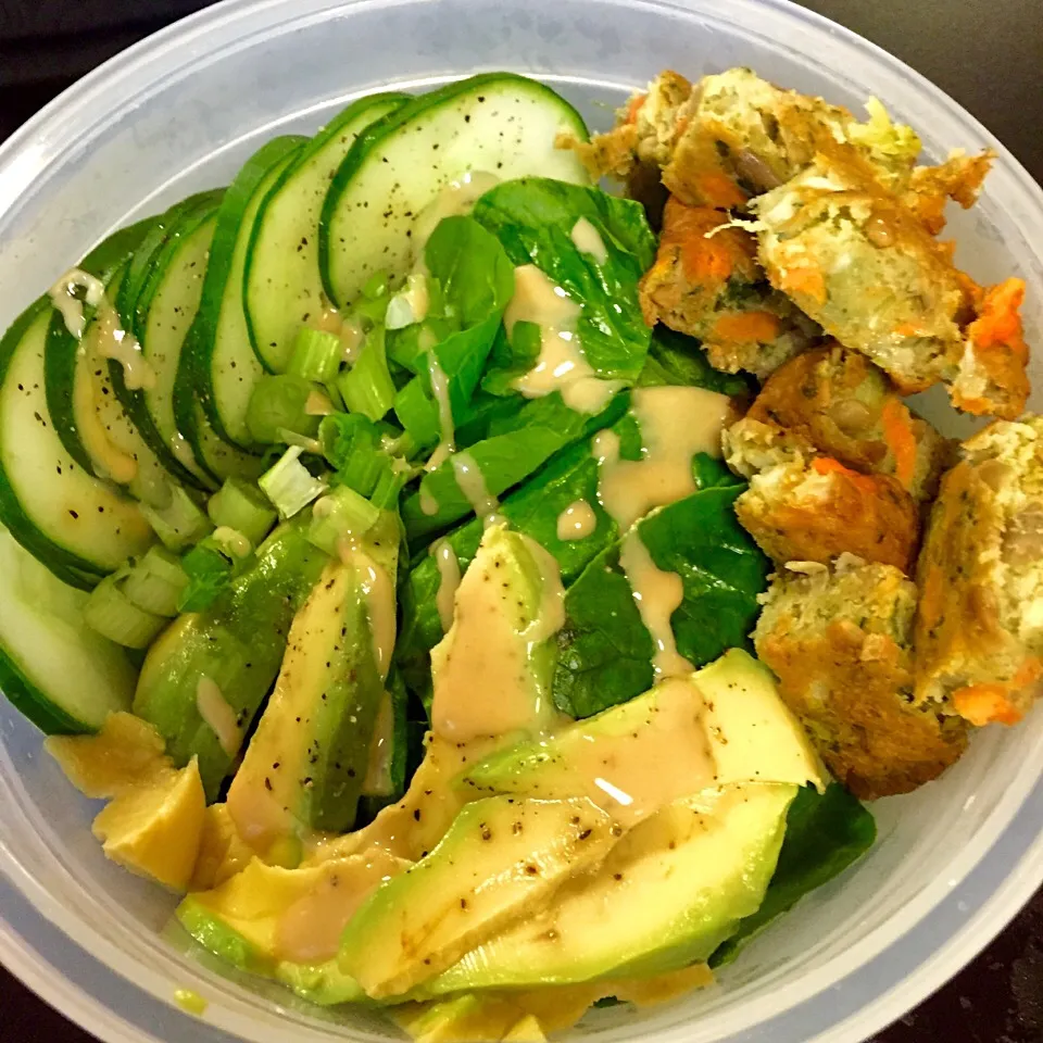 Snapdishの料理写真:School lunch: spinach salad with cucumber, avocado, green onions and organic veggie patty drizzled with tahini sauce|victoria valerioさん