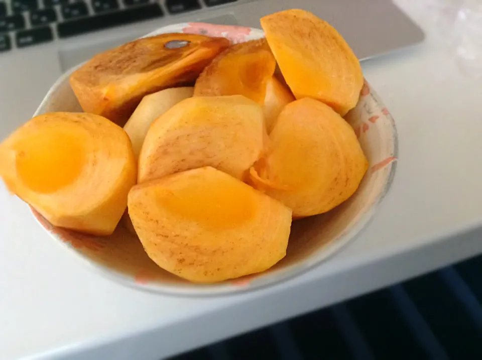 persimmon better known as japanese kaki fruits.fresh from our farm;)  yummy!;)|joさん