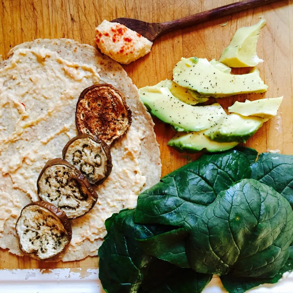 Snapdishの料理写真:Vegan wrap: whole wheat tortilla with homemade hummus, spinach, roasted eggplant, peppered avocado and cucumber|victoria valerioさん