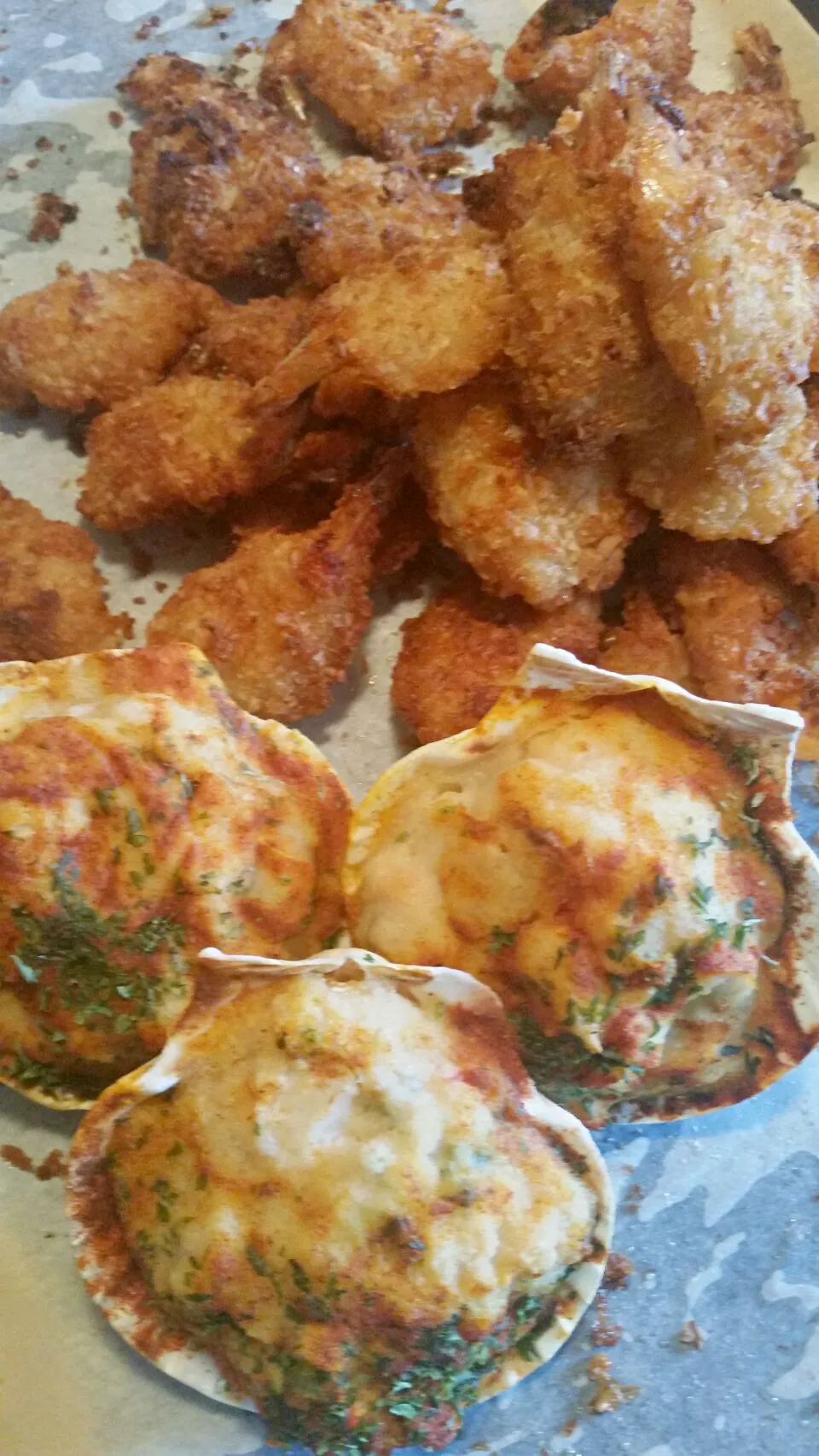 Coconut shrimp and stuffed scallops in a half shell.|CherylAnn Wheelerさん