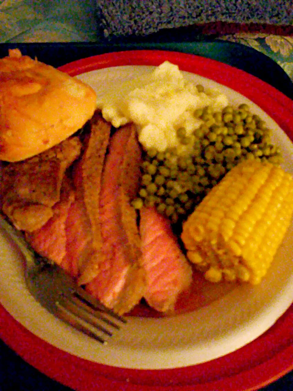 RIbeye steak i cut from a big piece from cosco myself  mashed potatos corn on the cob peas and a dinner roll|christl babcockさん