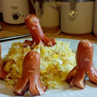 Snapdishの料理写真:Pinoy Breakfast - Fried Egg mixed with Rice & Hot Dogs|Y-vo Martinezさん