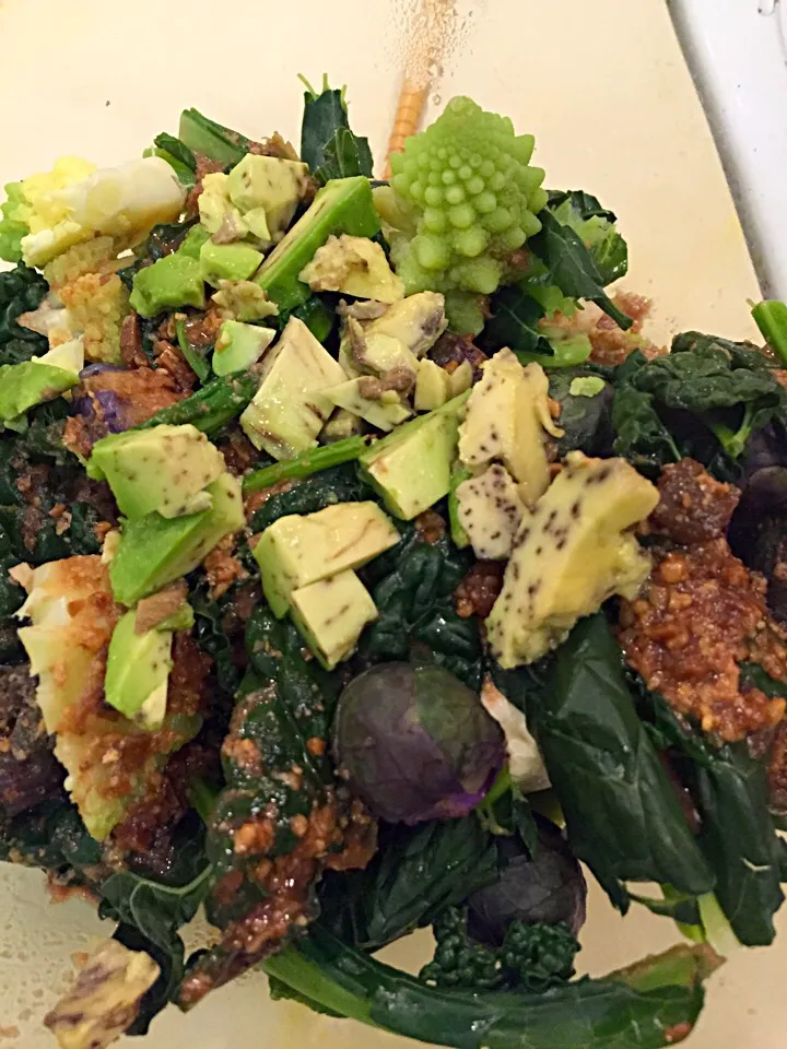 Steamed purple Brussels sprouts, kale, cauliflower and tofu in a miso-pomegranate sauce with avocado|georgianaさん