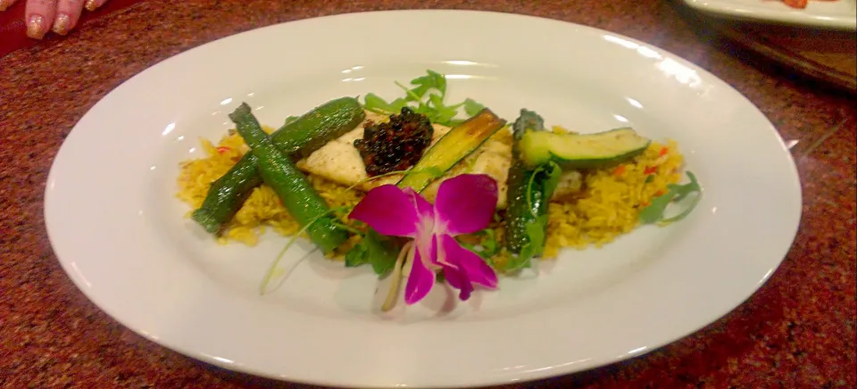 pan roasted flounder filet served over lemon saffron rice...topped with balsamic and cranberry caviar...|chef Charlesさん