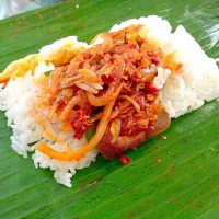 Snapdishの料理写真:Nasi lemak (coconut rice with sambal chilli wrapped in toasted banana leaf) 😊|eveさん