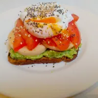 Sandwich,  protein bread, guacamole, chicken beast, tomato, poached egg,  sesame and chia seeds|Marina L.さん