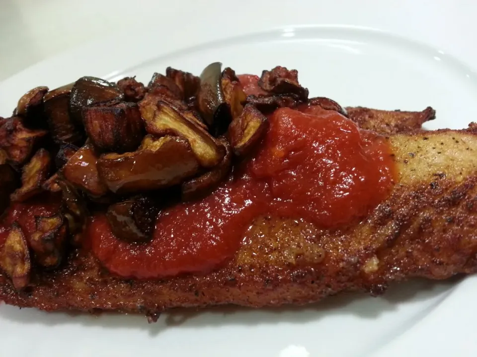 pan fried white fish in tomato sauce top with deep fried eggplants.|Anita Iavazzoさん