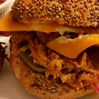 Snapdishの料理写真:BBQ pulled pork with Kim chi on a Chia seed bun with deep fried spaghetti balls.|CherylAnn Wheelerさん