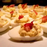 Deviled eggs with chopped jalapenos and bacon.