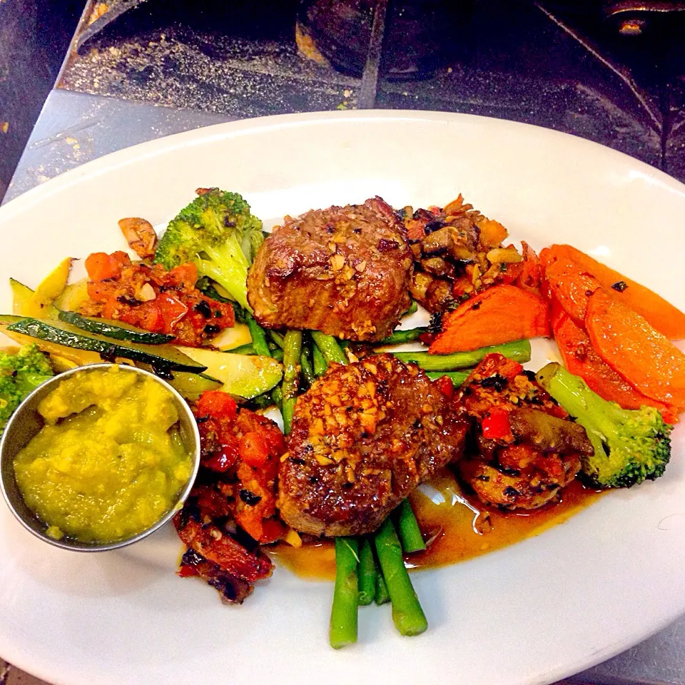 Sautéed Beef medallion with blackened mix chopped tomato and chopped chive and basil top on light blackened shrimp with sautéed veggies and green chili sauce..|Brent Baisdenさん