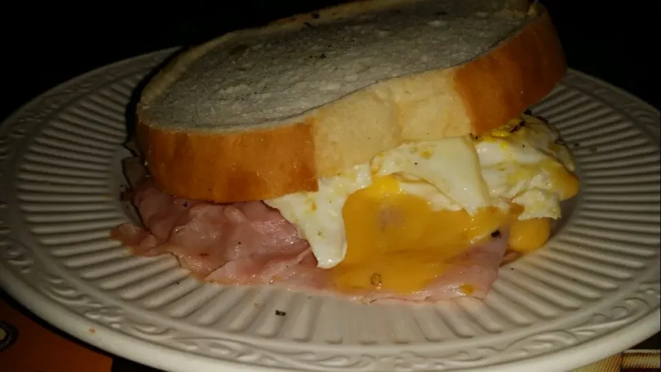 Breakfast after a long New Years party 
Fried Eggs Over Medium with Ham and Yellow American Cheese dash of fresh black pepper|Frank Ortizさん