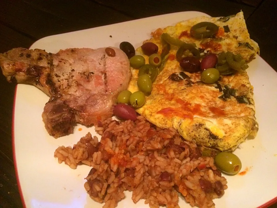 Snapdishの料理写真:Grilled pork chop, red beans & rice, feta cheese scallion omelet with olives and jalapeños!|fricks foodさん